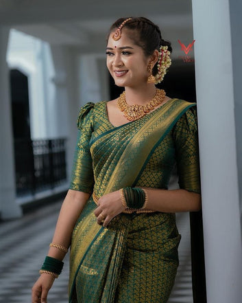 Stunning Dark Green Semi Silk Saree Weaved With Golden Zari With Attached Brocade Blouse