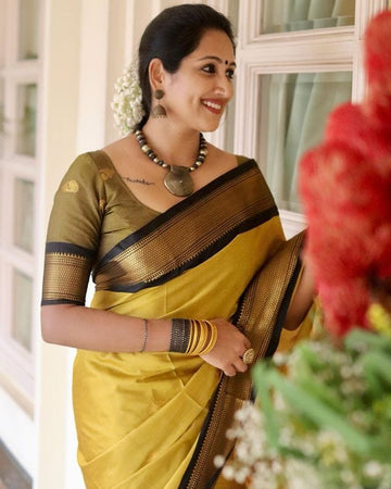 Symmetrical Yellow & Black Pure Soft Silk Saree With Engrossing Blouse Piece
