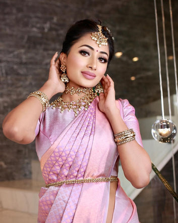 Stunning Baby Pink Semi Silk Saree Weaved With Golden Zari Comes With Heavy Brocade Blouse.